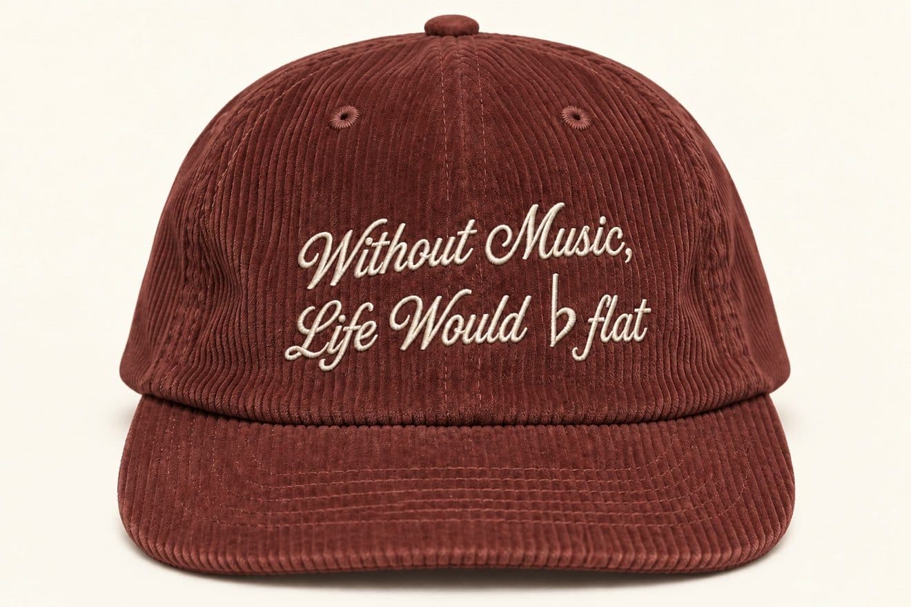 Rust corduroy hat embroidered with "Without Music, Life Would flat"